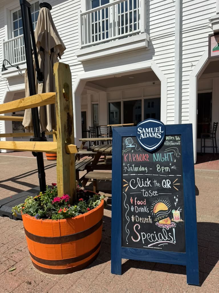 Valley Pub sidewalk sign by the patio entrance