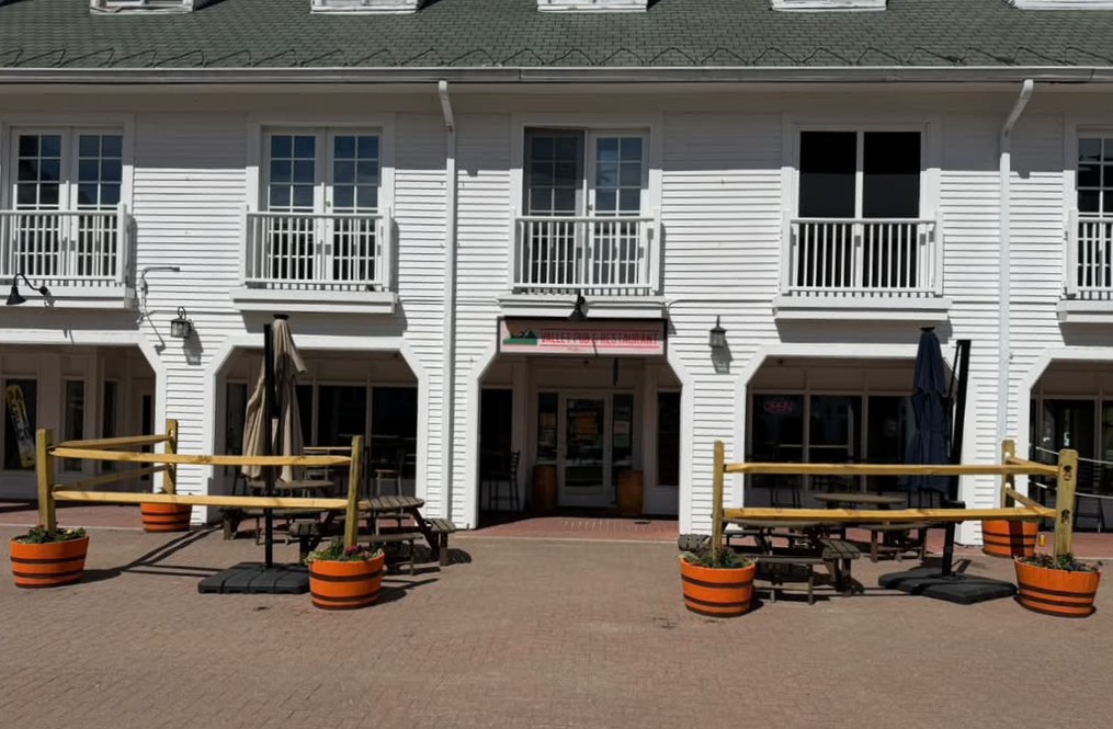 Valley Pub storefront and patio seating in Waterville Valley Town Square